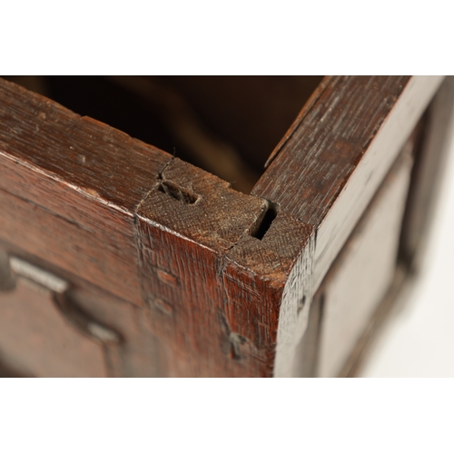 177 - A RARE 17TH CENTURY MINIATURE OAK COFFER with cross-banded moulded top above a double-panelled shape... 