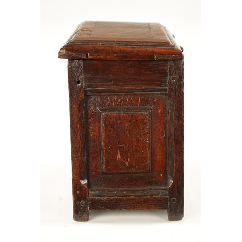 177 - A RARE 17TH CENTURY MINIATURE OAK COFFER with cross-banded moulded top above a double-panelled shape... 