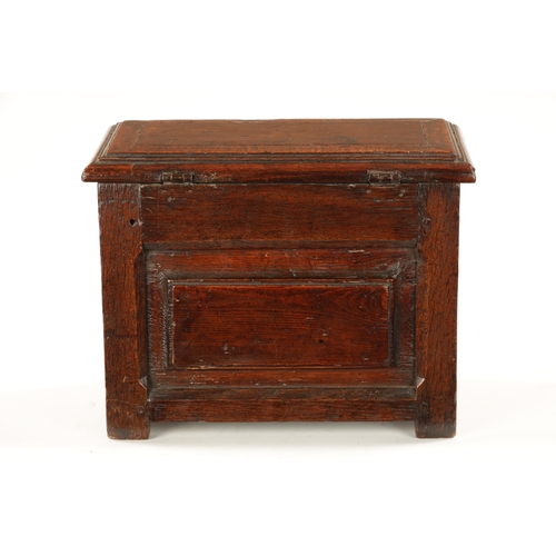 177 - A RARE 17TH CENTURY MINIATURE OAK COFFER with cross-banded moulded top above a double-panelled shape... 