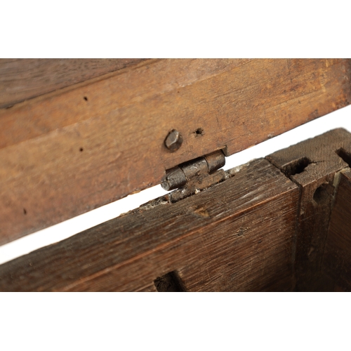 177 - A RARE 17TH CENTURY MINIATURE OAK COFFER with cross-banded moulded top above a double-panelled shape... 