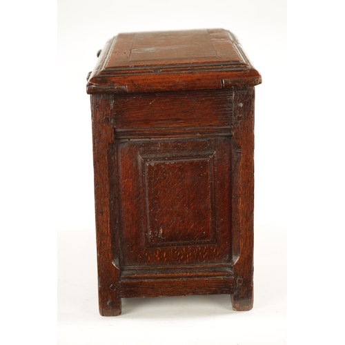 177 - A RARE 17TH CENTURY MINIATURE OAK COFFER with cross-banded moulded top above a double-panelled shape... 