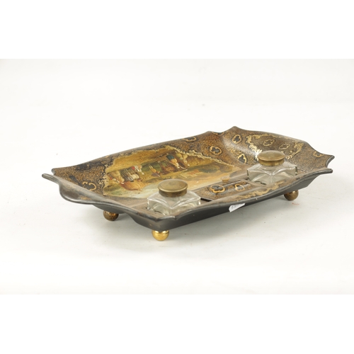 178 - A 19TH CENTURY PAPIER MACHE LACQUERED DESK INKSTAND with two glass ink wells and dished front, decor... 