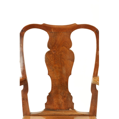 179 - A LARGE EARLY 18TH CENTURY WALNUT SPLAT BACK COUNTRY ARMCHAIR with solid seat and square moulded leg... 