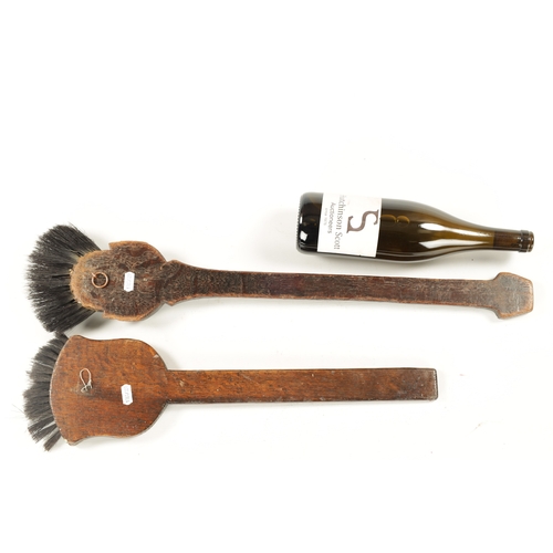 180 - TWO UNUSUAL EARLY 20TH CENTURY CARVED WOOD LONG-HANDLED COMICAL BRUSHES one depicting 'Billikin' (66... 