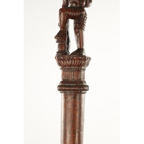 184 - AN EARLY 20TH CENTURY INDIAN CARVED HARDWOOD CANE WITH CARVED GODESS HANDLE (110cm high)