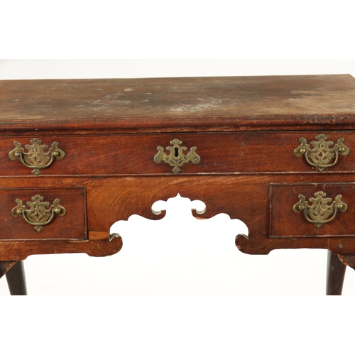 187 - A MID 18TH CENTURY MAHOGANY LOWBOY with three frieze drawers and shaped apron; raised on cabriole le... 