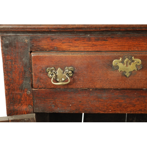 19 - AN EARLY 18TH CENTURY OAK TWO DRAWER DRESSER BASE the plank top above two frieze drawers and two fie... 