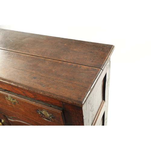 19 - AN EARLY 18TH CENTURY OAK TWO DRAWER DRESSER BASE the plank top above two frieze drawers and two fie... 