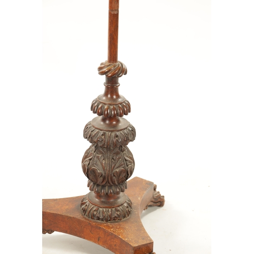 197 - A REGENCY CARVED OAK POLE SCREEN with adjustable top and platform base. (135cm high)