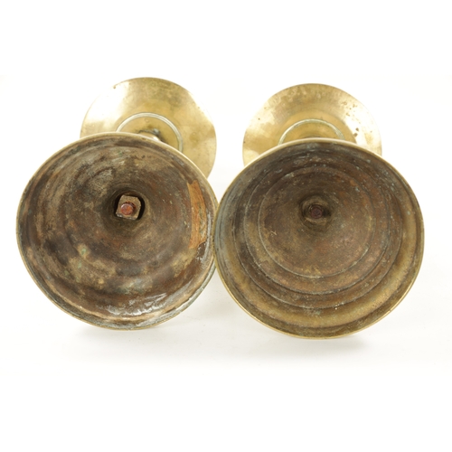 202 - A LARGE PAIR OF 18TH CENTURY BRASS CANDLESTICKS of rippled baluster form and centre drip trays