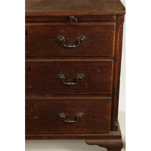 207 - AN 18TH CENTURY COUNTRY HOUSE OAK CHEST OF DRAWERS with brushing slide, fluted canted corners and th... 