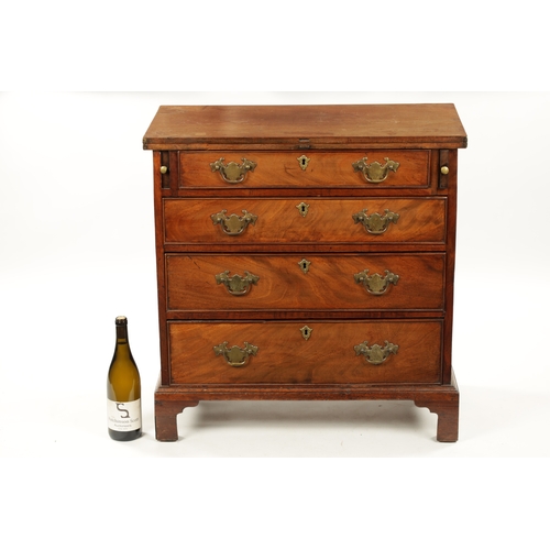 21 - A SMALL GEROGE III FIGURED MAHOGANY BACHELORS CHEST with fold over top above a bank of four drawers ... 