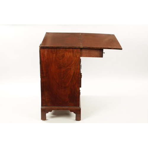 21 - A SMALL GEROGE III FIGURED MAHOGANY BACHELORS CHEST with fold over top above a bank of four drawers ... 