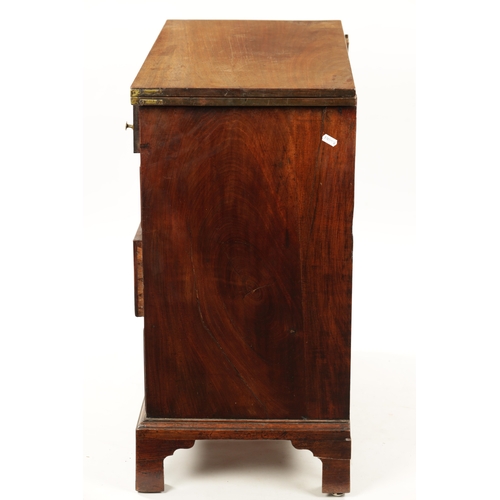 21 - A SMALL GEROGE III FIGURED MAHOGANY BACHELORS CHEST with fold over top above a bank of four drawers ... 