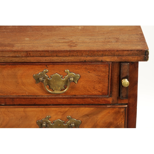 21 - A SMALL GEROGE III FIGURED MAHOGANY BACHELORS CHEST with fold over top above a bank of four drawers ... 