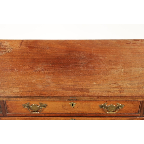 21 - A SMALL GEROGE III FIGURED MAHOGANY BACHELORS CHEST with fold over top above a bank of four drawers ... 