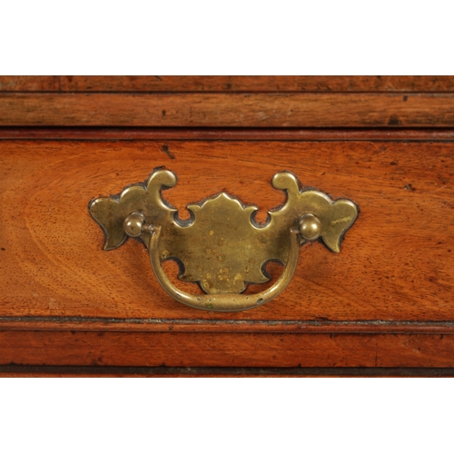 21 - A SMALL GEROGE III FIGURED MAHOGANY BACHELORS CHEST with fold over top above a bank of four drawers ... 