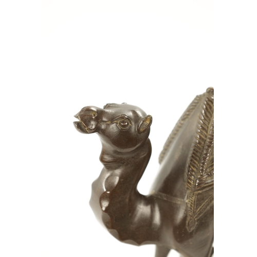 210 - AN EARLY 20TH CENTURY BRONZE SCULPTURE OF A CAMEL mounted on a marble base. (24cm high 21cm wide)