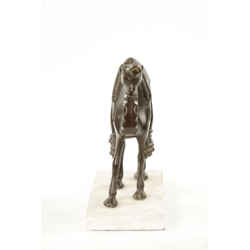 210 - AN EARLY 20TH CENTURY BRONZE SCULPTURE OF A CAMEL mounted on a marble base. (24cm high 21cm wide)