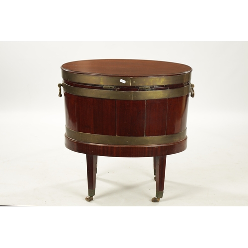 212 - A GEORGE III OVAL MAHOGANY WINE COOLER ON STAND with brass mounts and side handles; raised on taperi... 