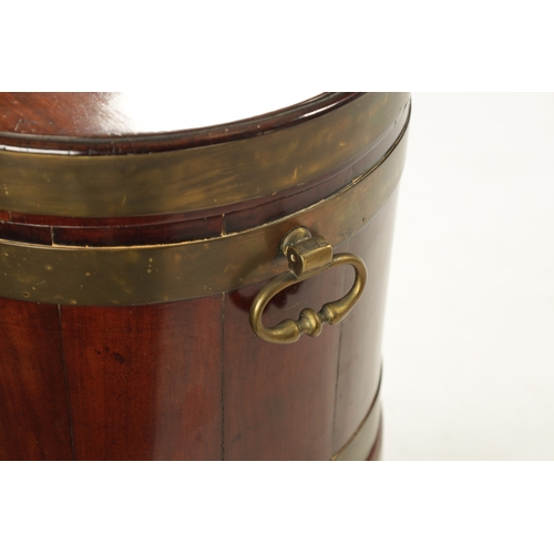 212 - A GEORGE III OVAL MAHOGANY WINE COOLER ON STAND with brass mounts and side handles; raised on taperi... 