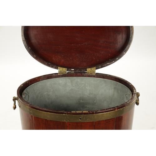 212 - A GEORGE III OVAL MAHOGANY WINE COOLER ON STAND with brass mounts and side handles; raised on taperi... 