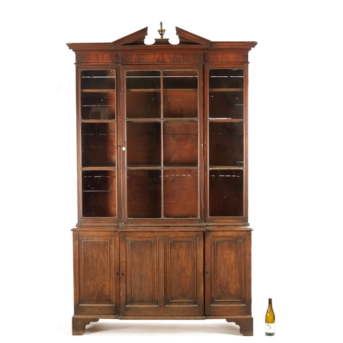 218 - A RARE SMALL SIZED GEORGE II MAHOGANY BREAKFRONT LIBRARY BOOKCASE with architectural pediment above ... 