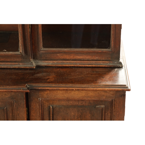 218 - A RARE SMALL SIZED GEORGE II MAHOGANY BREAKFRONT LIBRARY BOOKCASE with architectural pediment above ... 