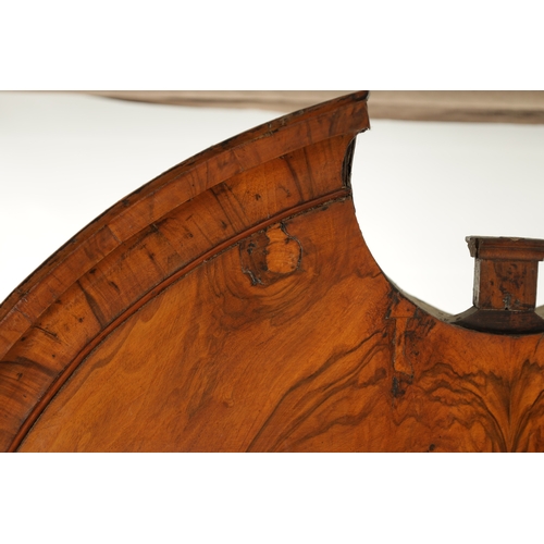 219 - AN EARLY 18TH CENTURY FIGURED WALNUT AND OAK BREAK ARCHED TOP BUREAU BOOKCASE the double arched mirr... 