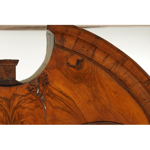 219 - AN EARLY 18TH CENTURY FIGURED WALNUT AND OAK BREAK ARCHED TOP BUREAU BOOKCASE the double arched mirr... 