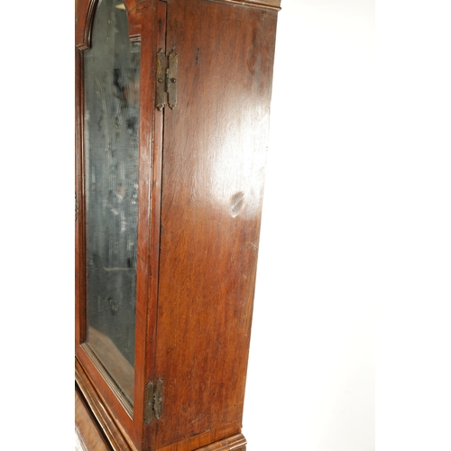 219 - AN EARLY 18TH CENTURY FIGURED WALNUT AND OAK BREAK ARCHED TOP BUREAU BOOKCASE the double arched mirr... 