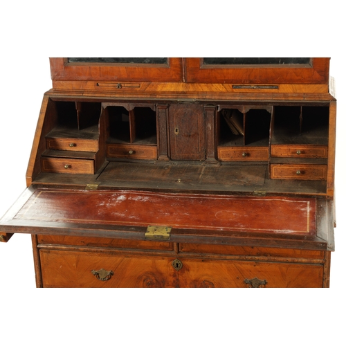 219 - AN EARLY 18TH CENTURY FIGURED WALNUT AND OAK BREAK ARCHED TOP BUREAU BOOKCASE the double arched mirr... 