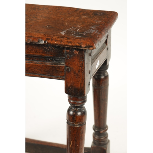 22 - A 17TH CENTURY AND LATER OAK JOINT STOOL WITH POLLARD OAK BURR TOP raised on ring turned supports jo... 