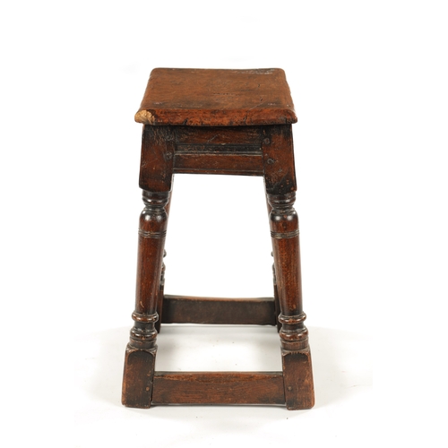 22 - A 17TH CENTURY AND LATER OAK JOINT STOOL WITH POLLARD OAK BURR TOP raised on ring turned supports jo... 