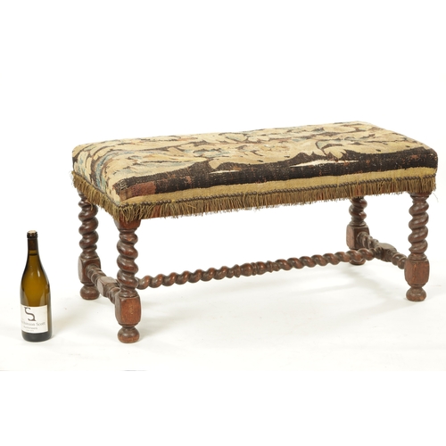 223 - A WILLIAM & MARY OAK BARLEY TWIST STOOL with tapestry upholstered seat. (94cm wide 44cm deep 44cm hi... 