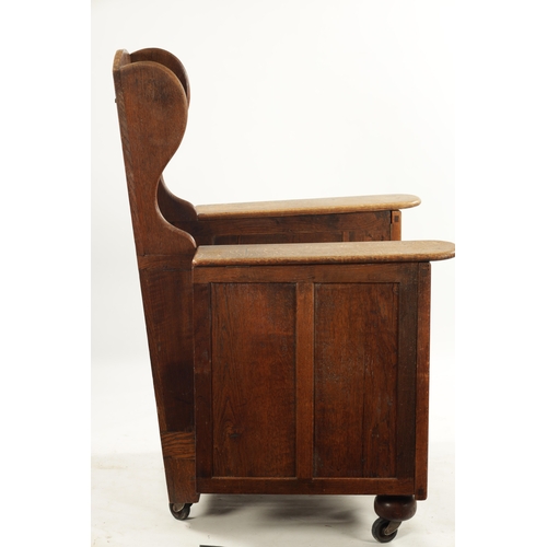 226 - AN ARTS AND CRAFTS METAMORPHIC OAK ARMCHAIR with hinged side arms, having detachable reading table; ... 