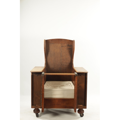 226 - AN ARTS AND CRAFTS METAMORPHIC OAK ARMCHAIR with hinged side arms, having detachable reading table; ... 