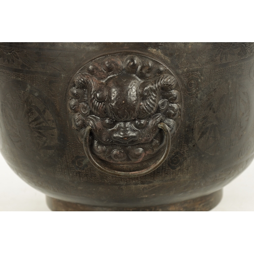 227 - A RARE 17TH/18TH CENTURY CHINESE BRONZE JARDINIERE OF LARGE SIZE with lions head handle and engraved... 