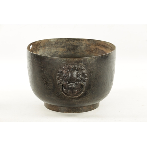 227 - A RARE 17TH/18TH CENTURY CHINESE BRONZE JARDINIERE OF LARGE SIZE with lions head handle and engraved... 