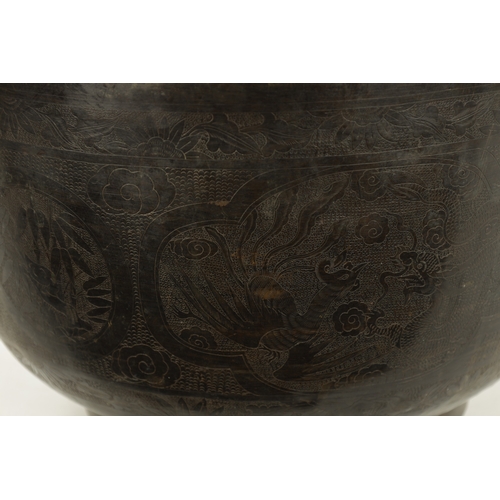 227 - A RARE 17TH/18TH CENTURY CHINESE BRONZE JARDINIERE OF LARGE SIZE with lions head handle and engraved... 