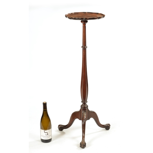 232 - A 19TH CENTURY MAHOGANY CANDLE TABLE with pie crust dished top above a shaped stem with tripod base ... 