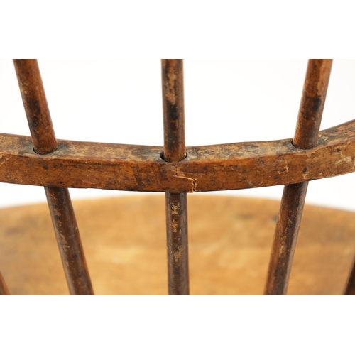 235 - A 19TH CENTURY AMERICAN PRIMITIVE STICK BACK WINDSOR CHAIR with oval seat and ring turned legs. (88c... 