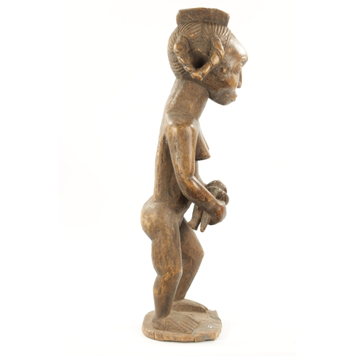 238 - AN ANTIQUE NATIVE CARVED HARDWOOD FIGURE OF LADY WITH CHILD (72cm high)