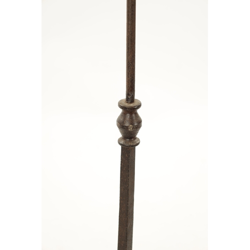 241 - A SET OF FOUR IRONWORK CHURCH FLOOR STANDING CANDLESTICKS with knopped stems and tripod bases (115cm... 