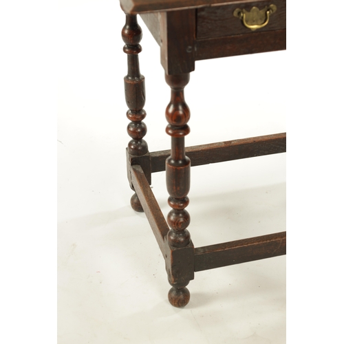 242 - A SMALL 17TH CENTURY OAK SIDE TABLE with frieze drawer and ring turned legs (68cm wide 46cm deep 69c... 