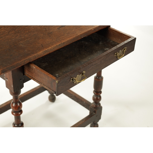 242 - A SMALL 17TH CENTURY OAK SIDE TABLE with frieze drawer and ring turned legs (68cm wide 46cm deep 69c... 