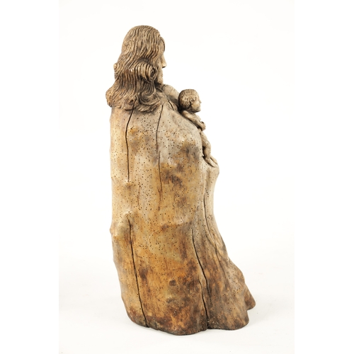 25 - AN ANTIQUE FOLK ART ROOT-WOOD CARVING OF A MOTHER AND CHILD (61cm high)