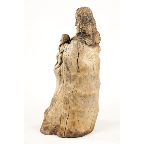 25 - AN ANTIQUE FOLK ART ROOT-WOOD CARVING OF A MOTHER AND CHILD (61cm high)