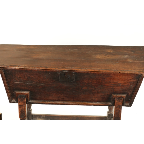 250 - AN EARLY 18TH CENTURY ELM AND OAK DOUGH BIN with lift off top; raised on a turned base. (122cm wide ... 