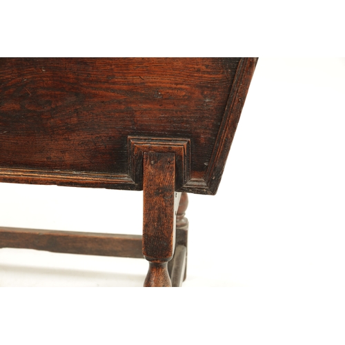 250 - AN EARLY 18TH CENTURY ELM AND OAK DOUGH BIN with lift off top; raised on a turned base. (122cm wide ... 